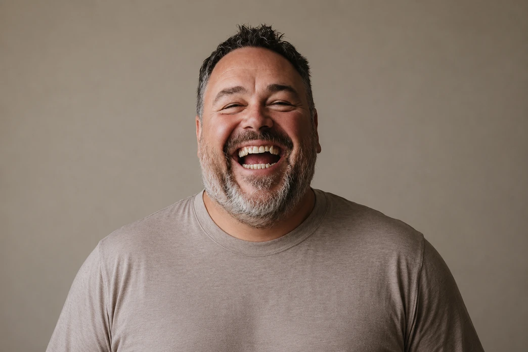 Laughing man in a grey t-shirt