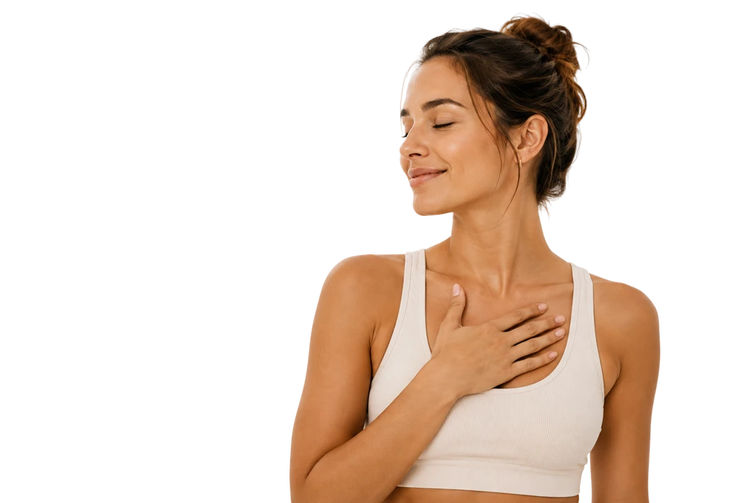 Woman with closed eyes resting a hand on her chest